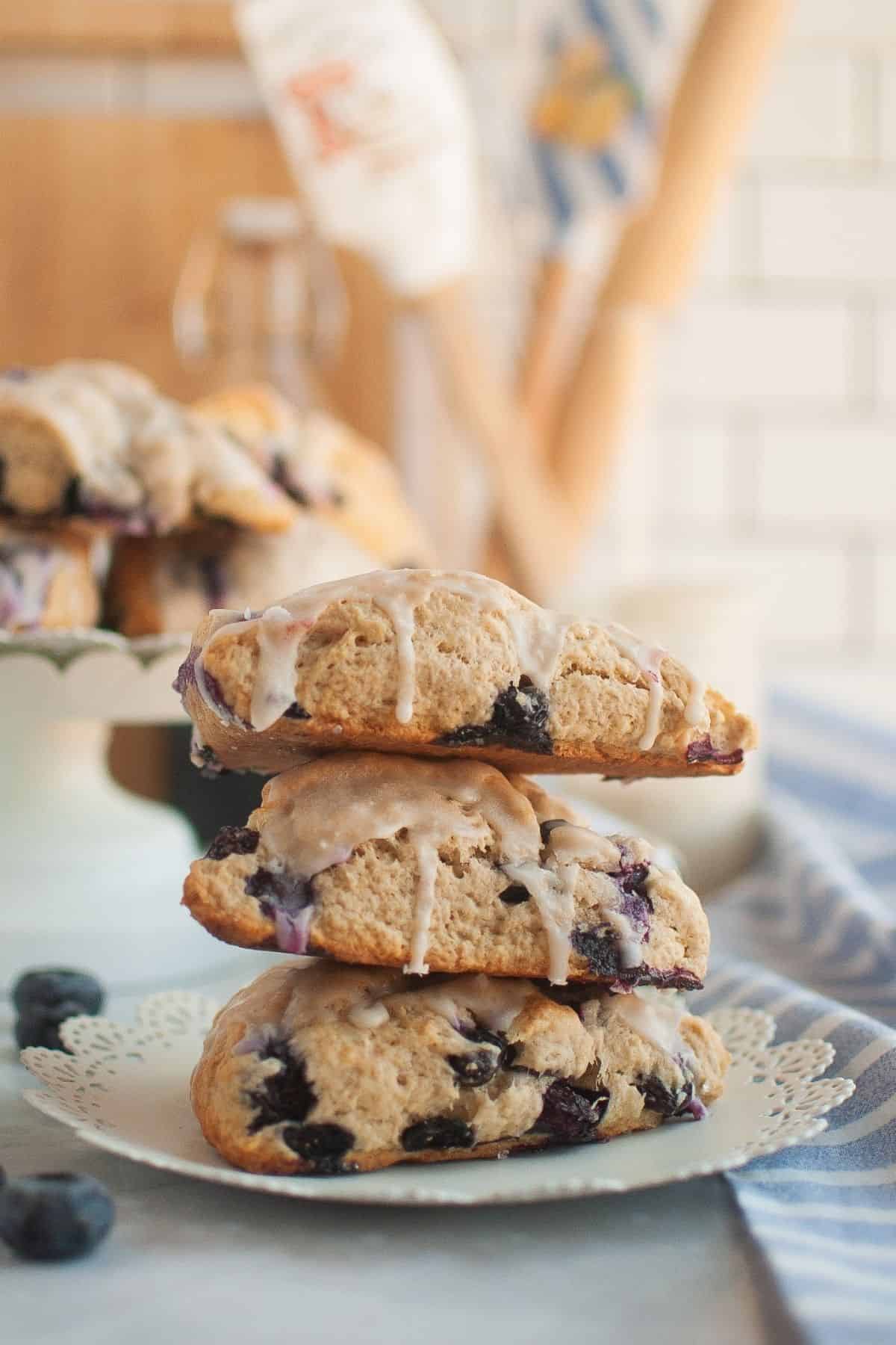 Fresh sourdough blueberry cream scones stacked on a plate, ready to enjoy.