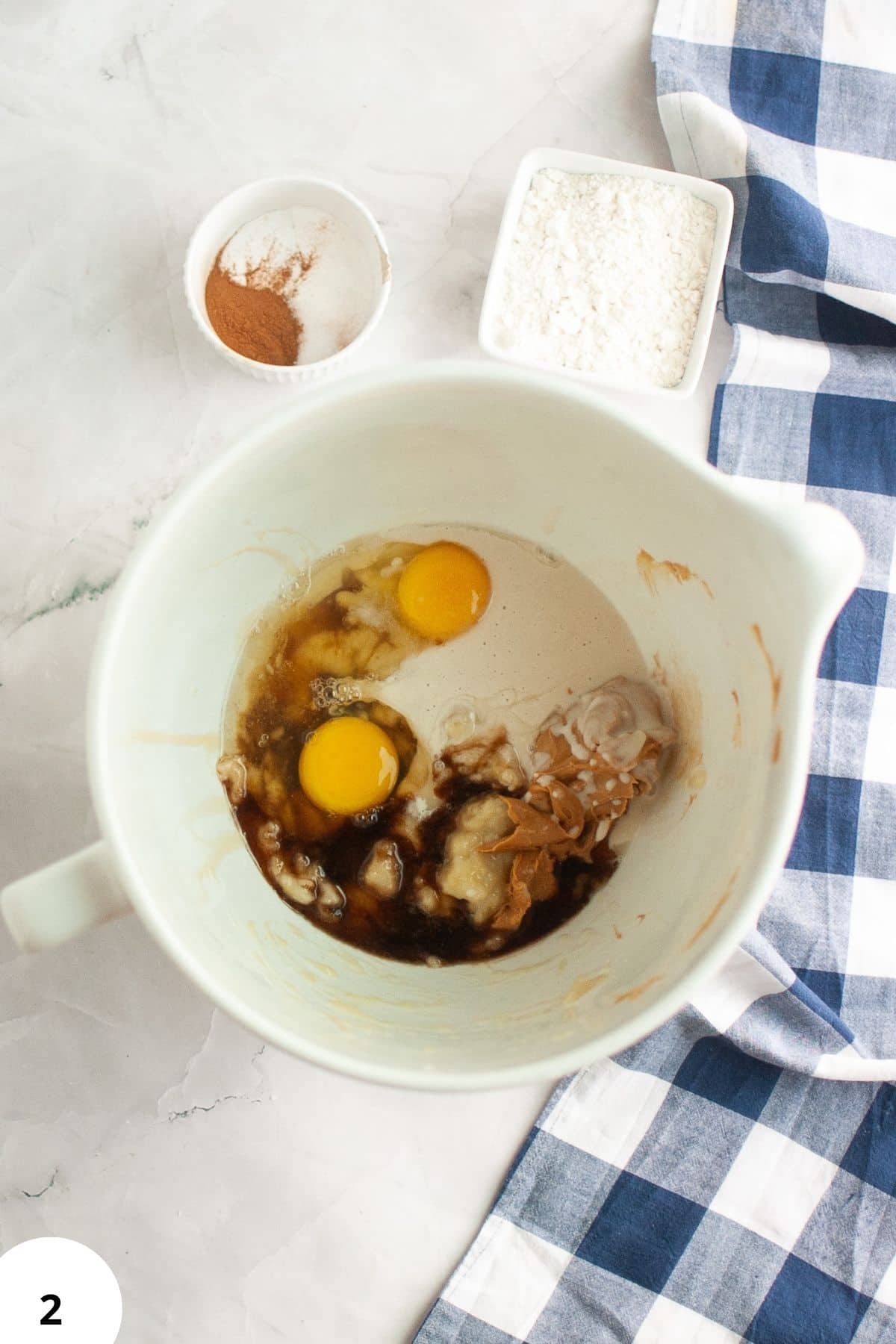 Sourdough bread dough in a mixing bowl with stretch and folds technique, ready for fermentation.