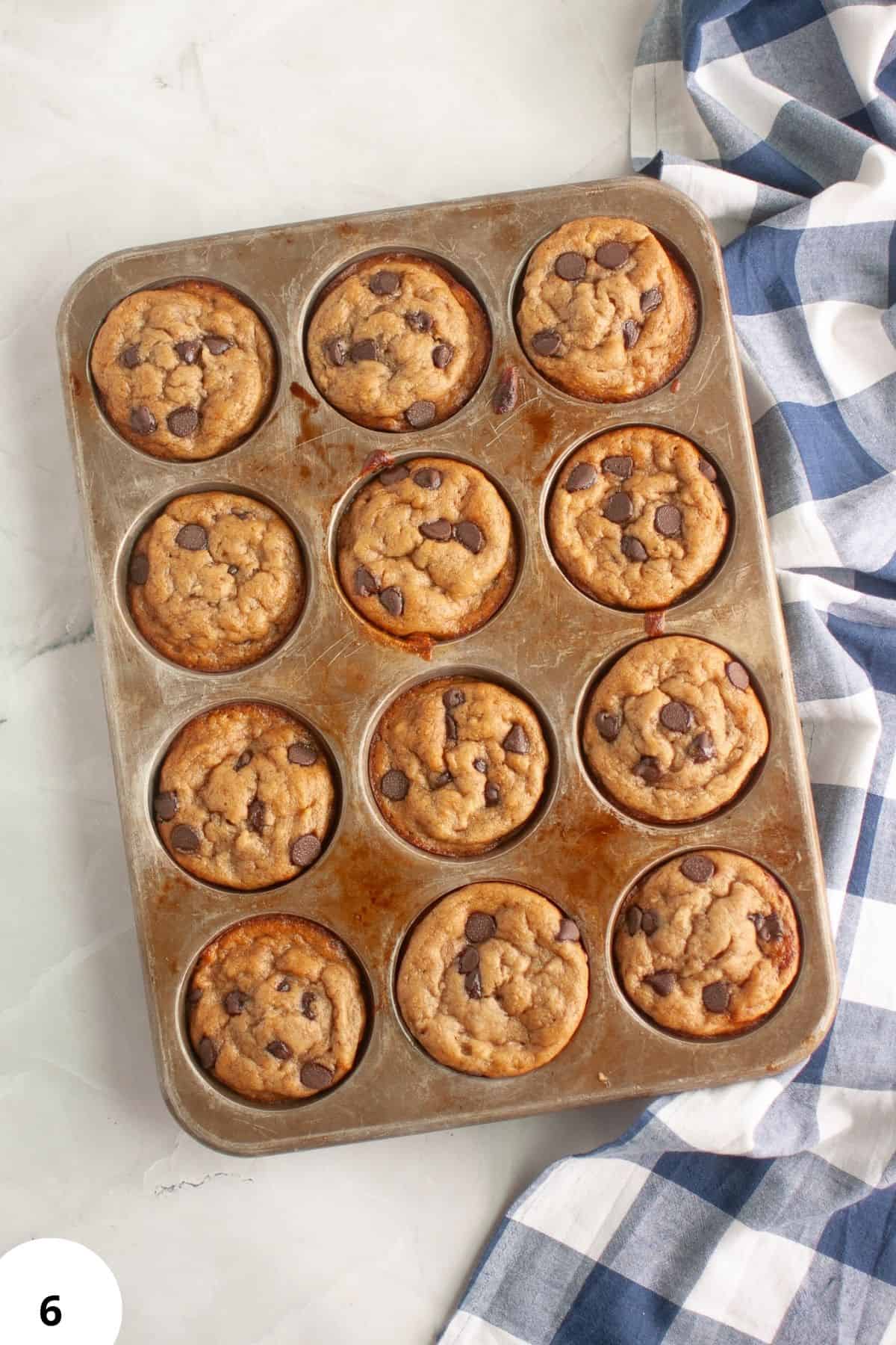 Delicious sourdough discard banana muffins filled with chocolate chips, perfect for breakfast or sna.