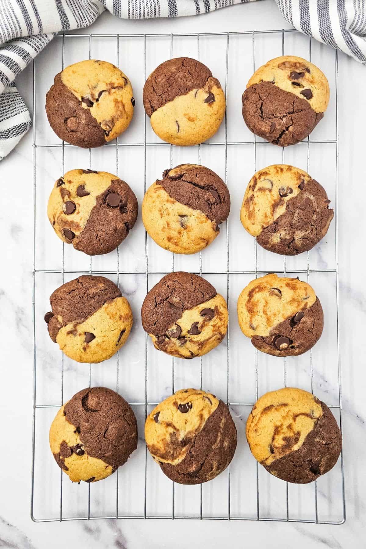 Freshly baked chocolate chip brookies cooling on a wire rack.