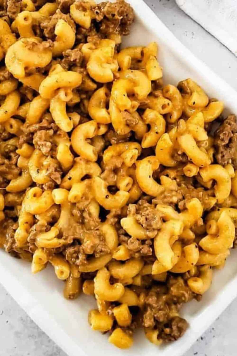 Homemade macaroni and beef casserole with cheese and savory ground beef, perfect comfort food for fa.