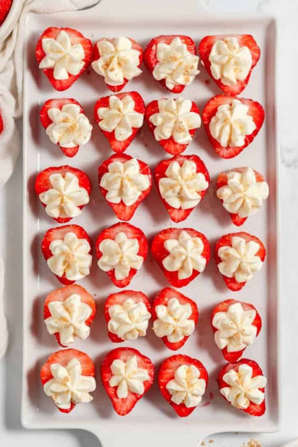 Fresh strawberries filled with whipped cream, perfect for Mother's Day celebrations.