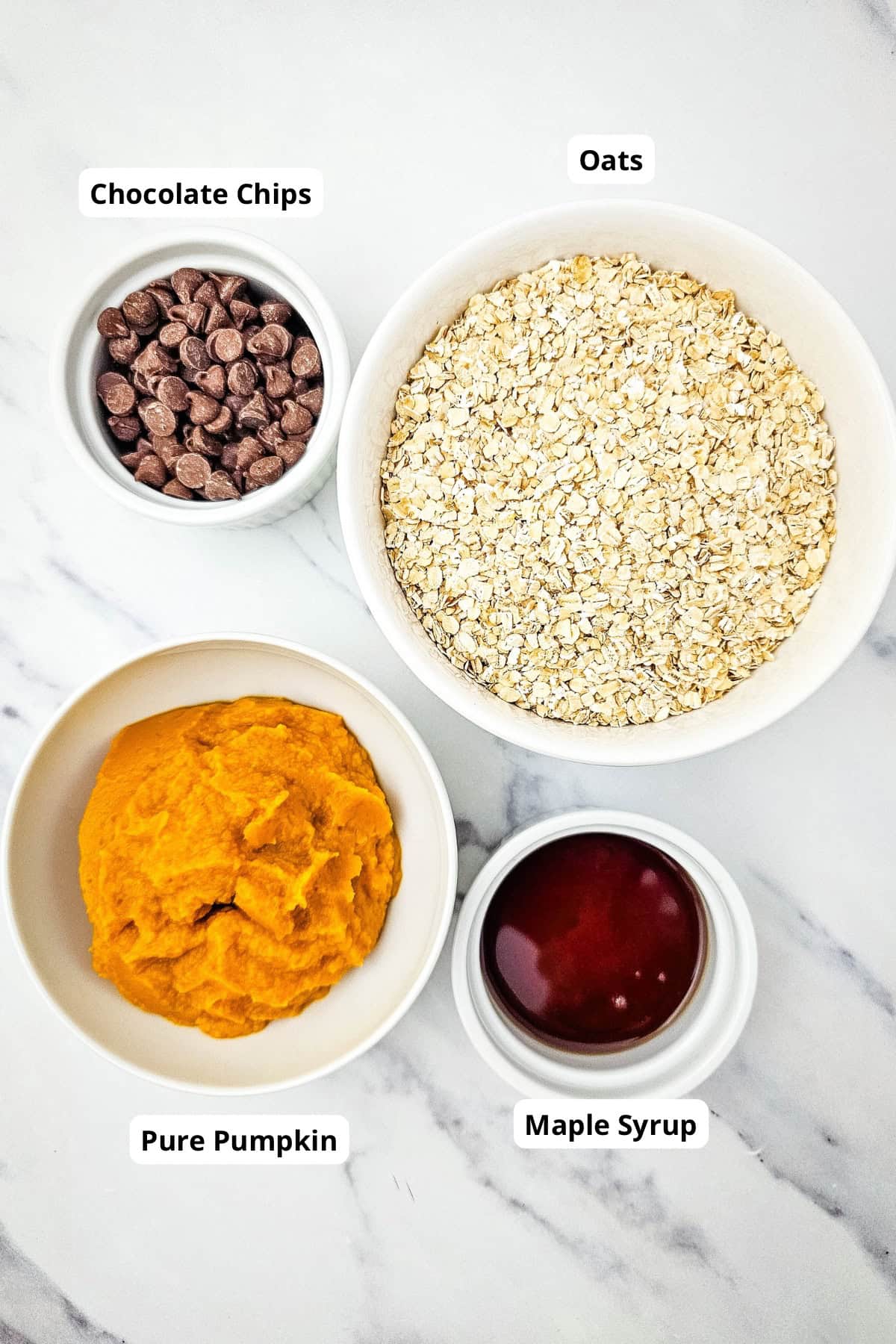 Oats, pumpkin, chocolate chips, maple syrup, and pure pumpkin for cookies.
