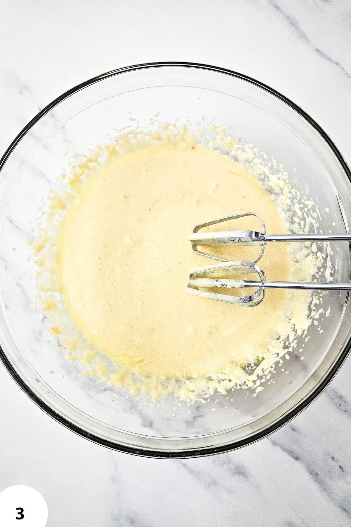 Mixing batter for blackberry muffins with streusel topping.