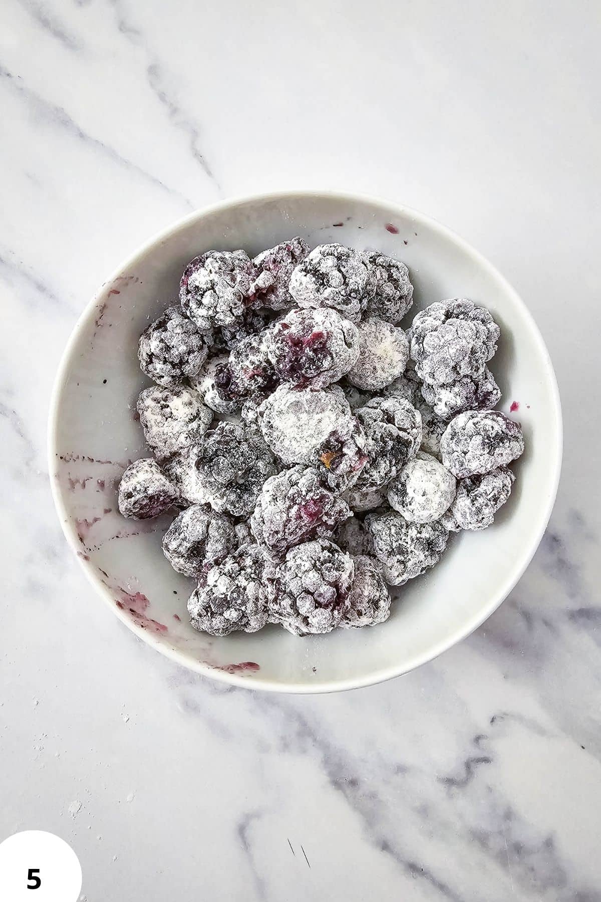 Blackberries for baking and toppings, frozen and dusted with flour.