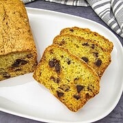 Chocolate chip zucchini bread slices on a white plate.