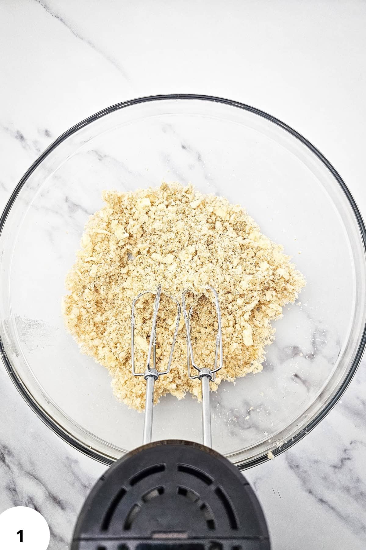 Mixing bowl with cookie dough for soft oatmeal raisin applesauce cookies.