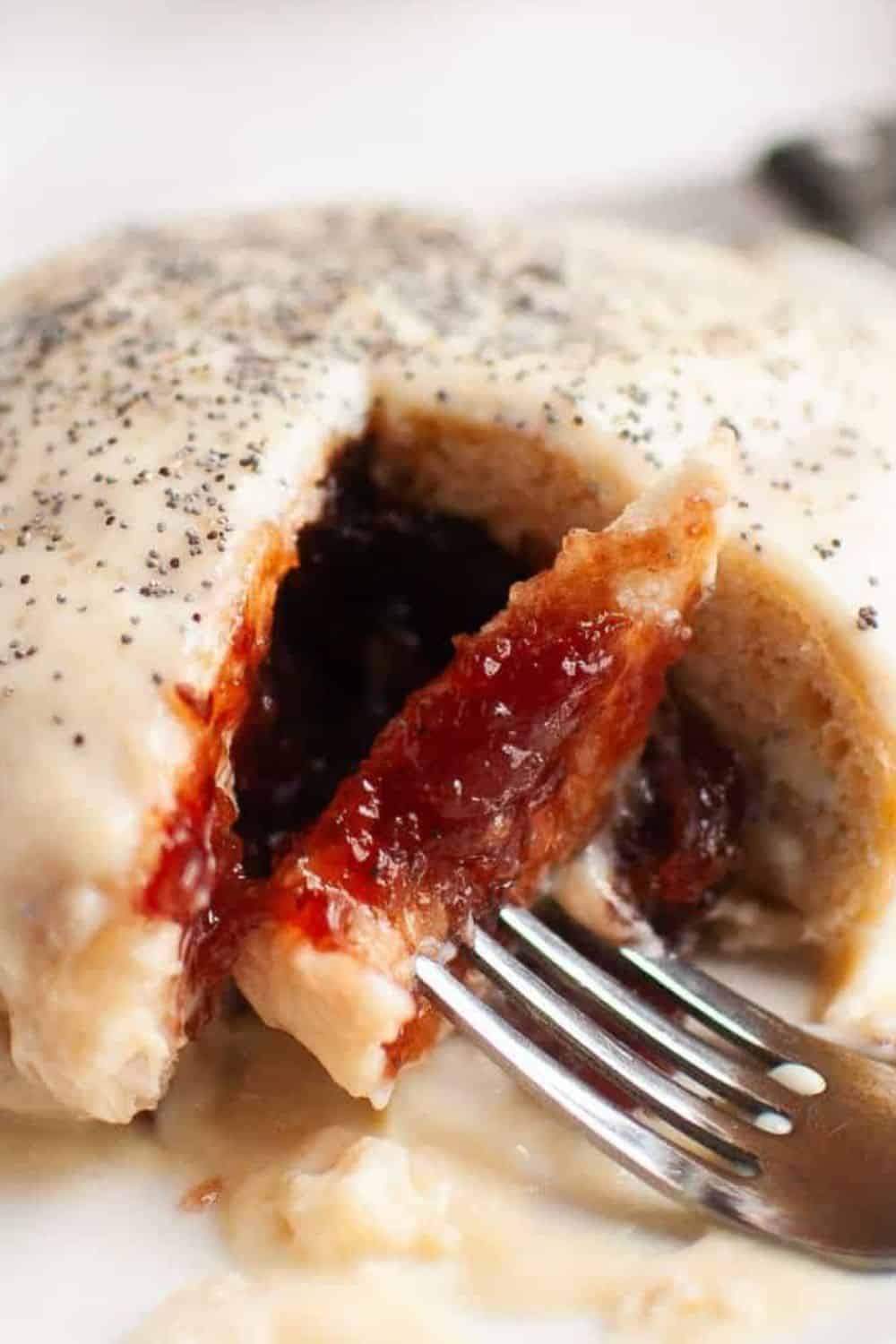 Freshly baked fruit-filled pastry with a flaky crust and sweet jam center.