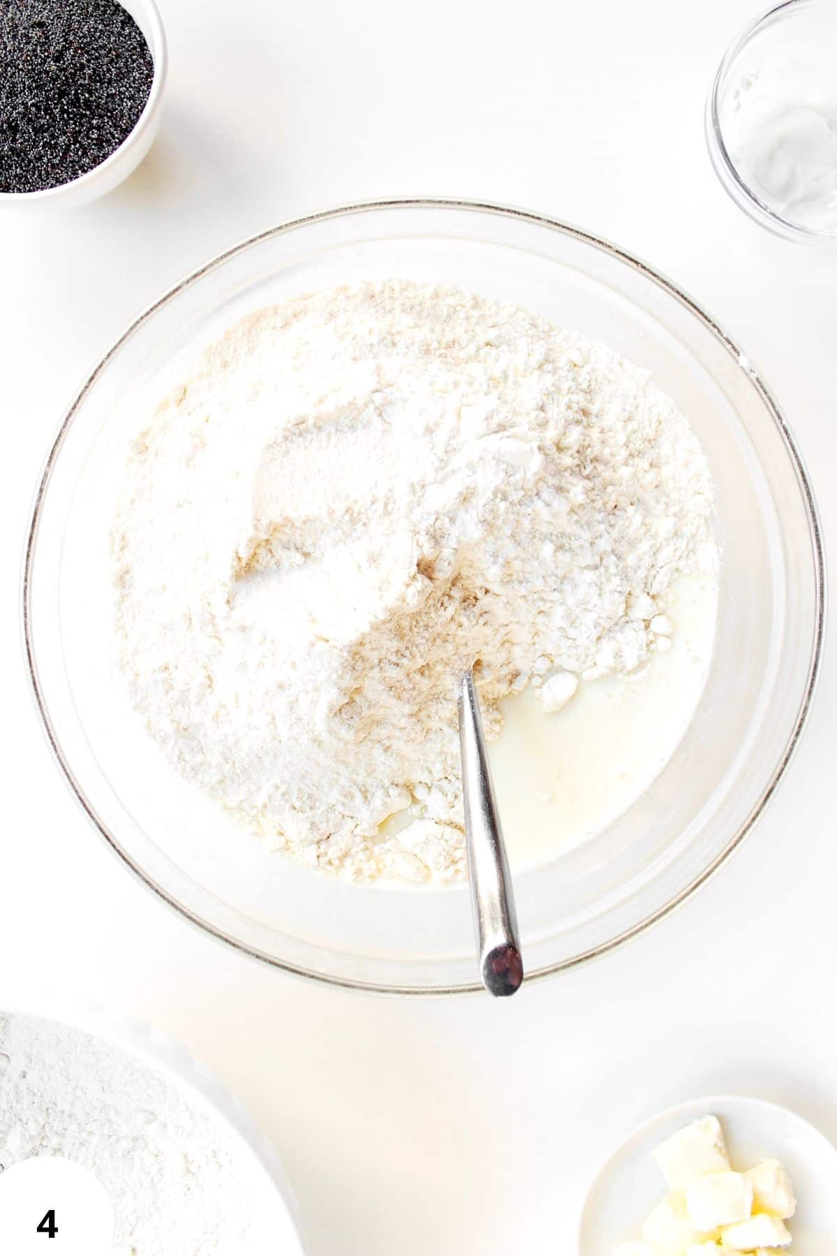 Sourdough bread dough during stretch and fold process with flour and water.