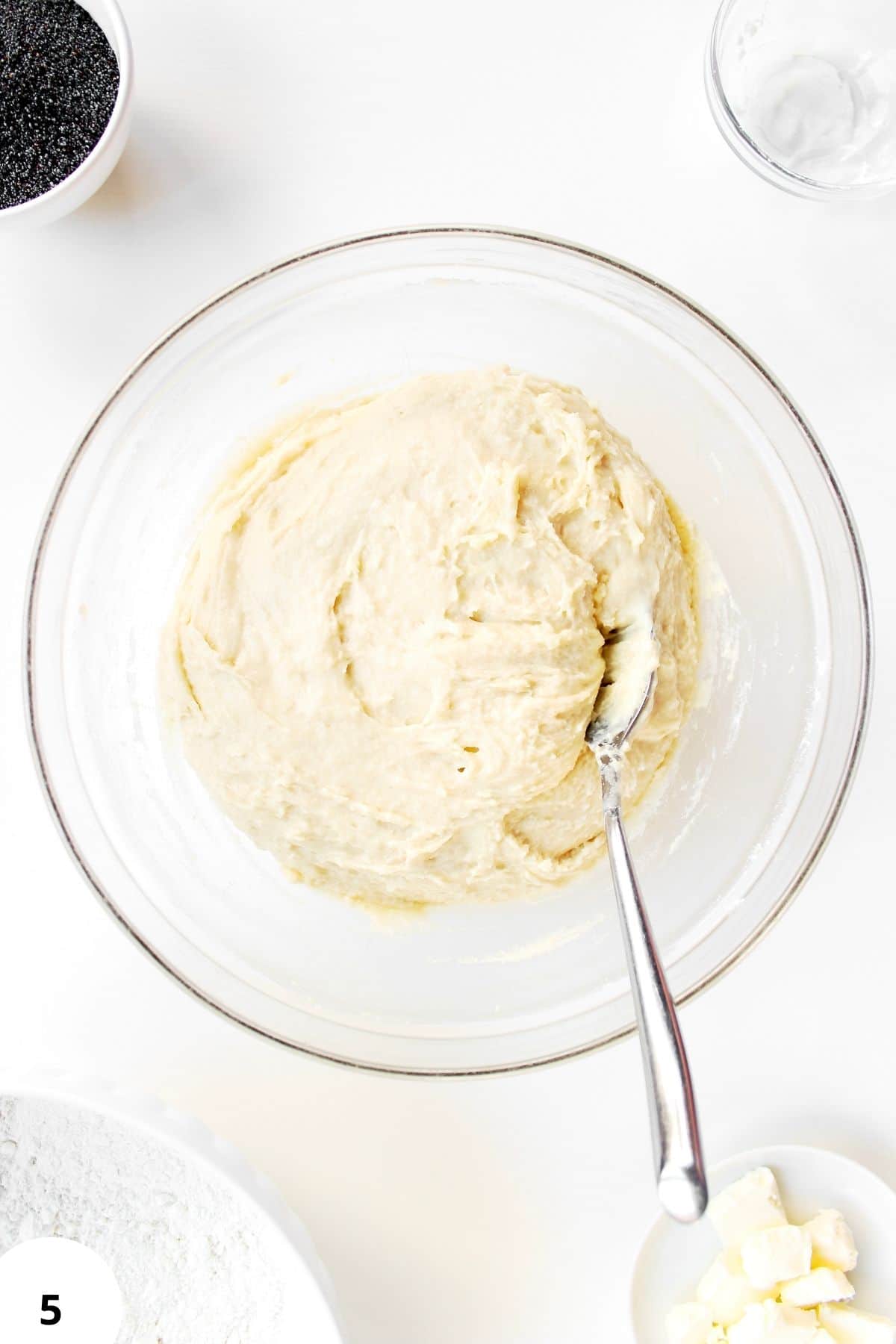 Sourdough dough being folded during stretch and fold process for bread making.