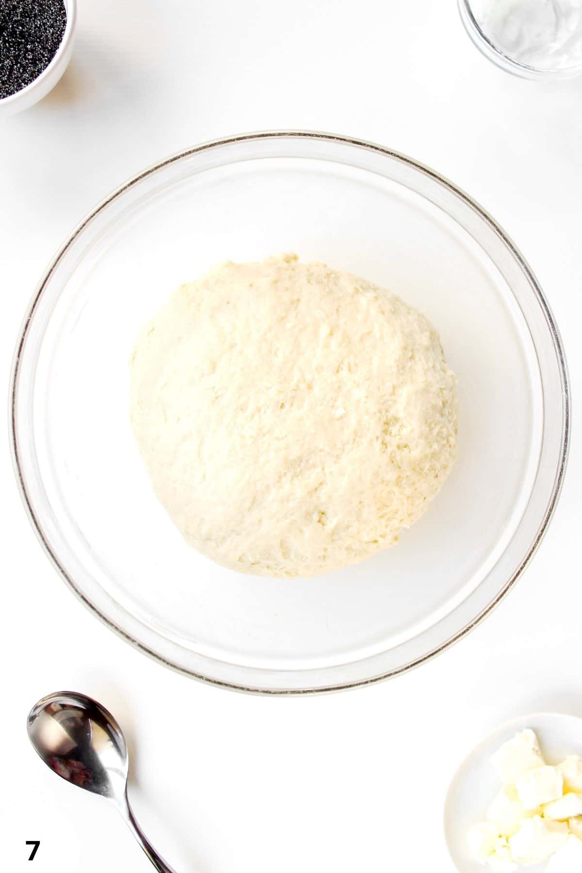 Sourdough dough during stretch and fold process for bread baking.
