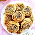Sourdough rolls with poppy seeds, showcasing stretch and fold techniques. Perfect for baking enthusi.