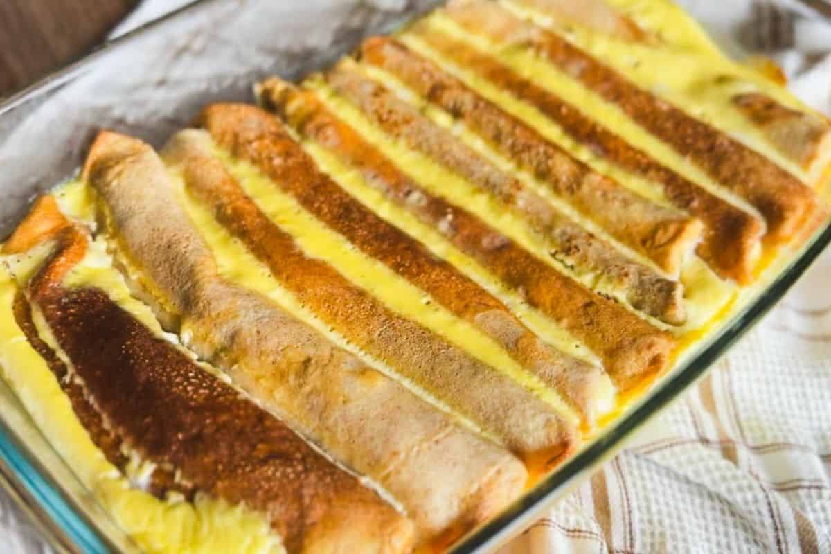Delicious baked crepes filled with sweet cheese, perfect for dessert or breakfast. A delightful trea.