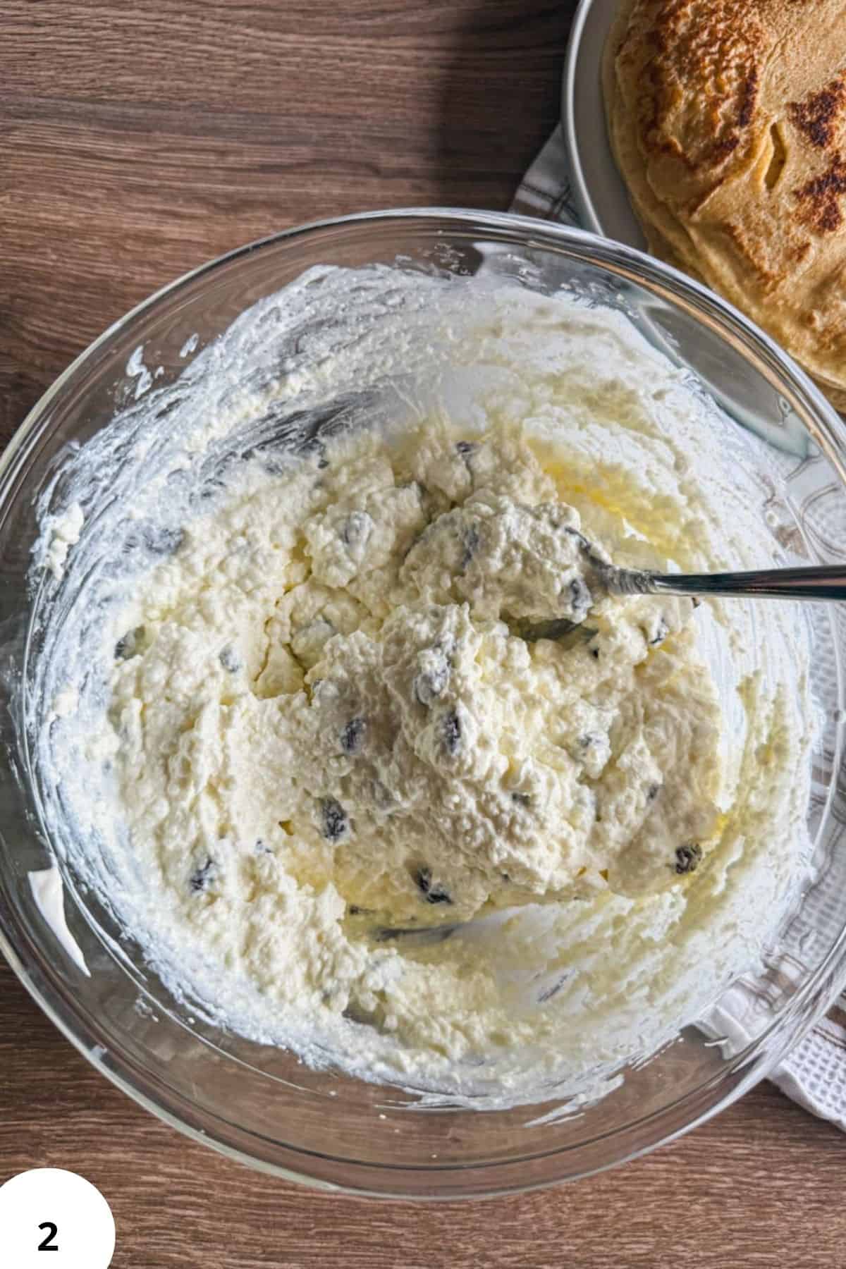 Dough mixture with flour and butter for baked crepes, ready to be folded.