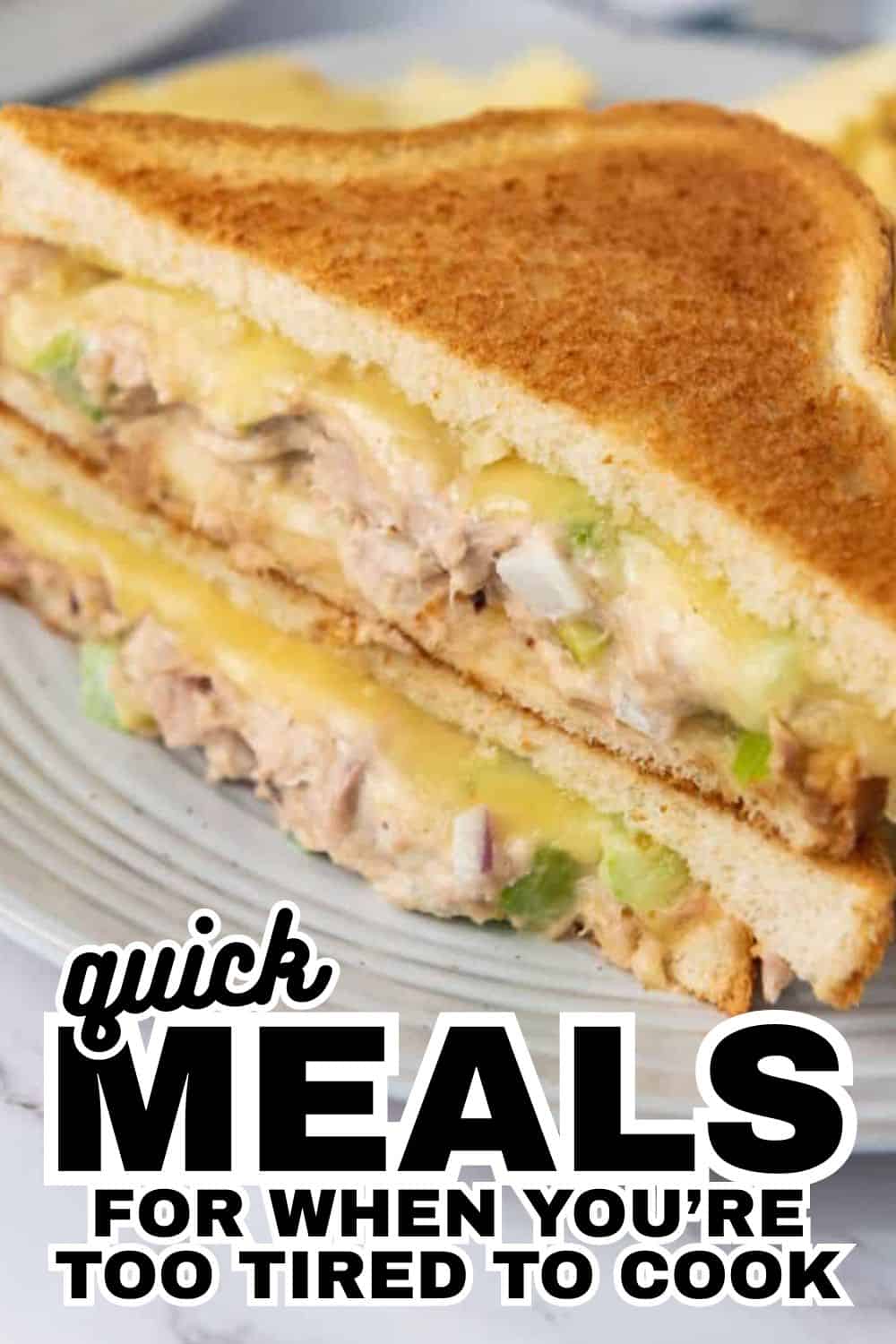 Close-up of a toasted tuna melt sandwich with melted cheese and celery.