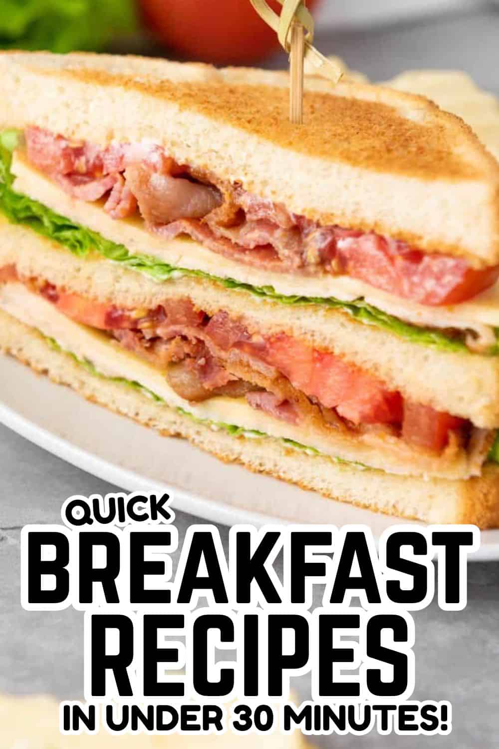 Close-up of a sandwich made with stretch and folds bread, filled with ham, lettuce, and tomato.