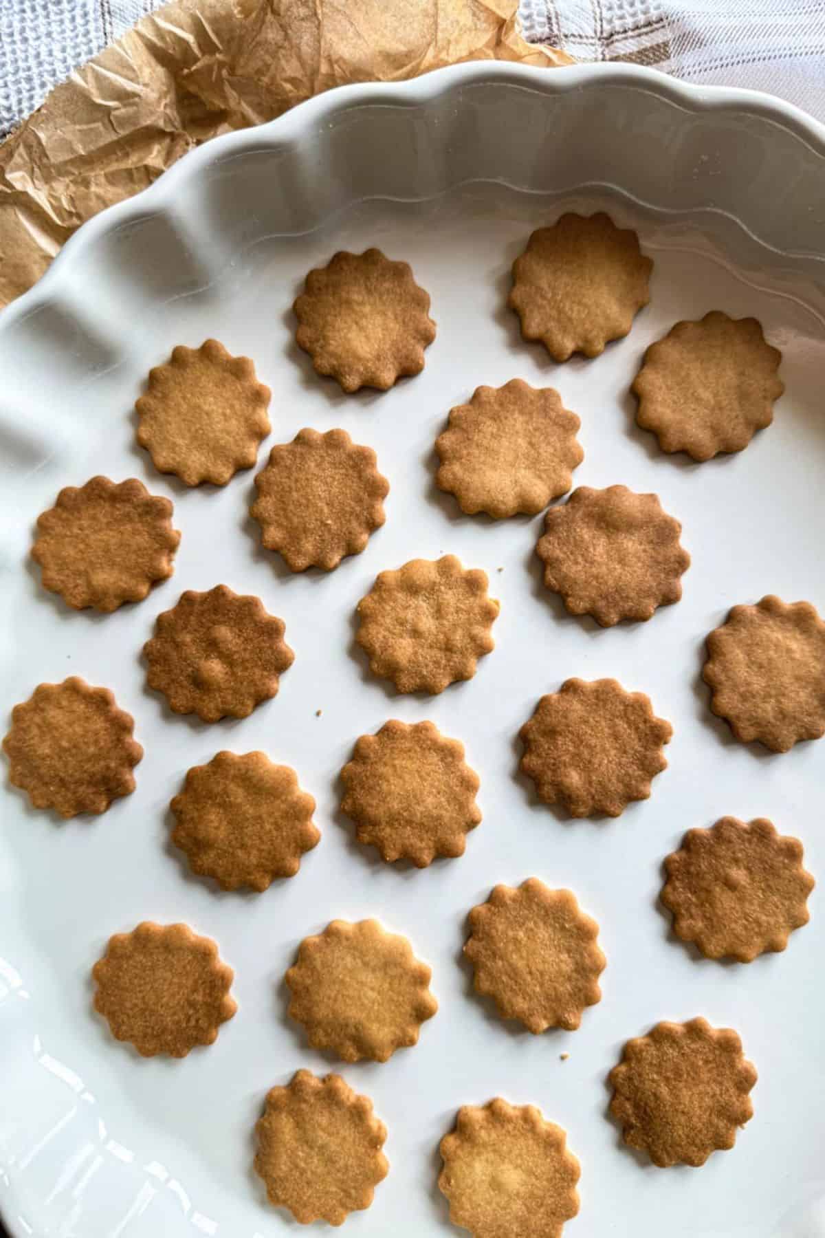 Assorted classic European butter cookies on a white platter.