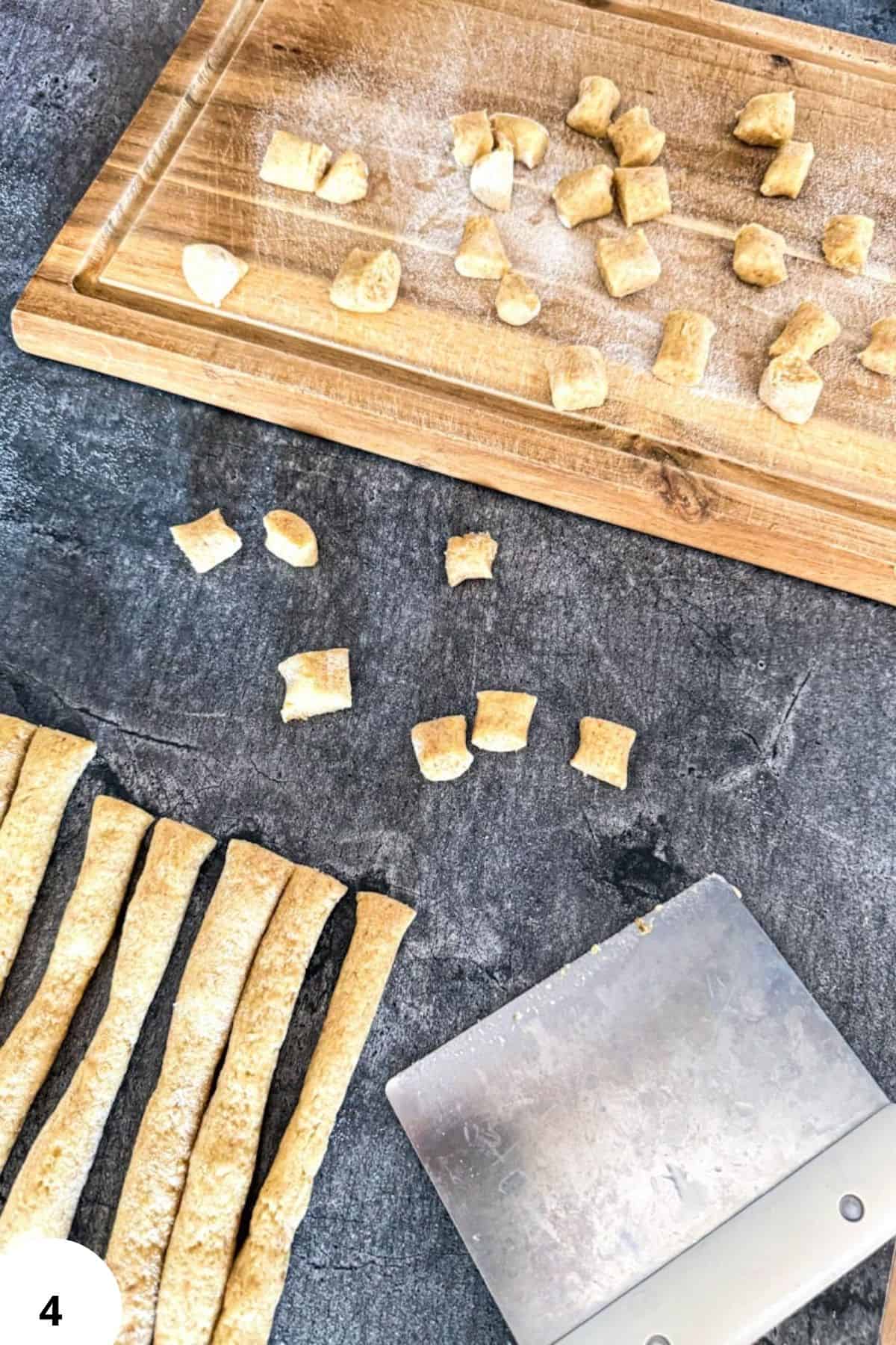 Homemade gnocchi made with fresh-milled flour on a rustic kitchen countertop.