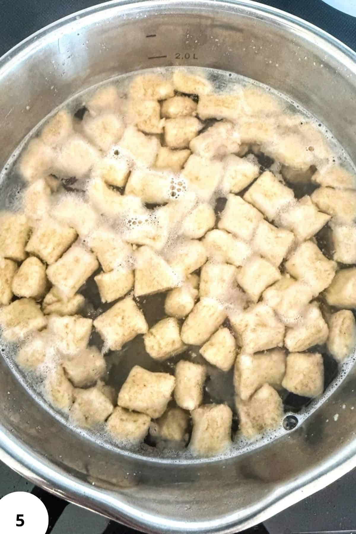 Fresh-Milled Flour Gnocchi Cooking in a Pot.