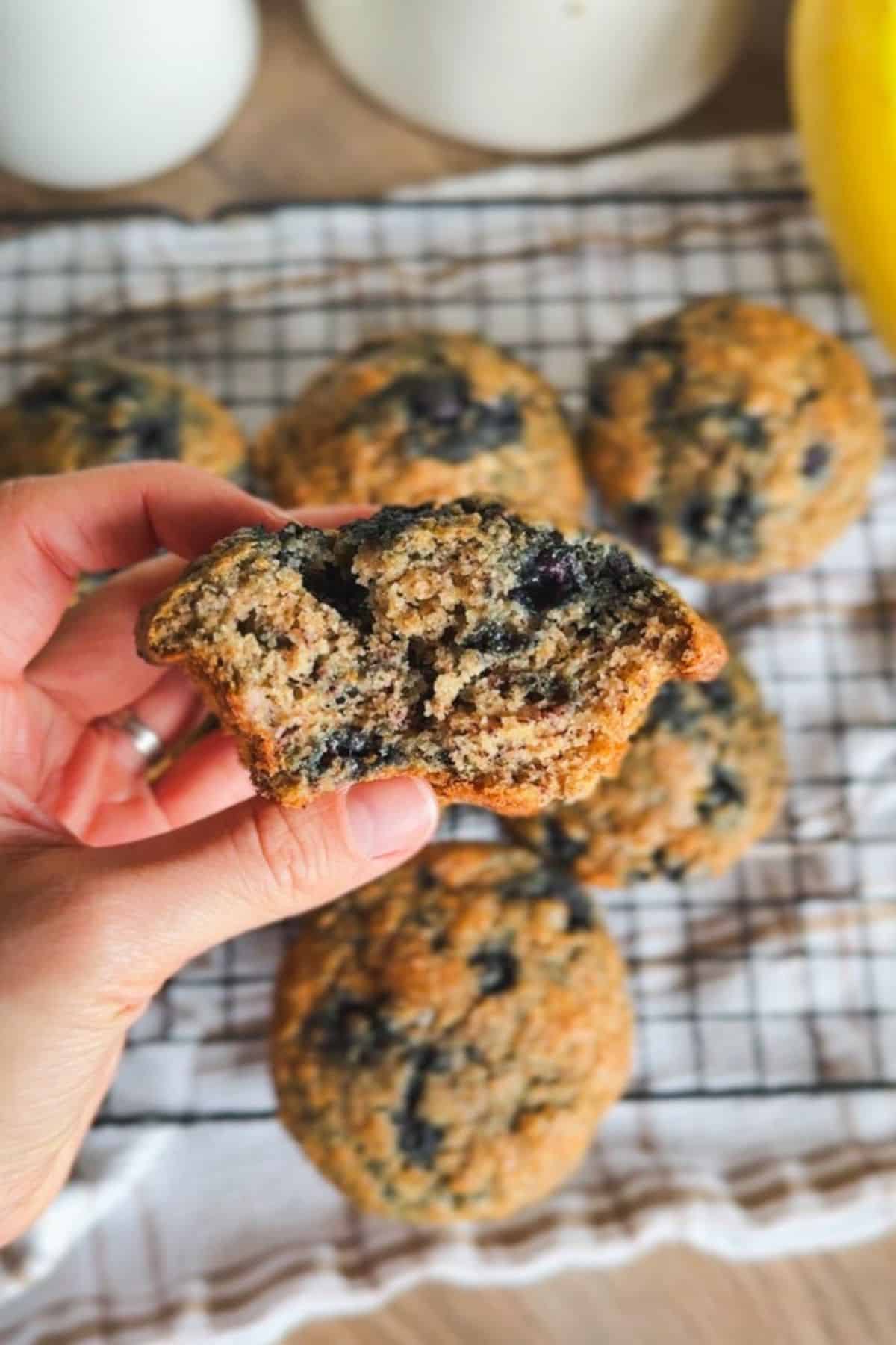 Freshly baked blueberry banana muffins with a golden crust and juicy blueberries.