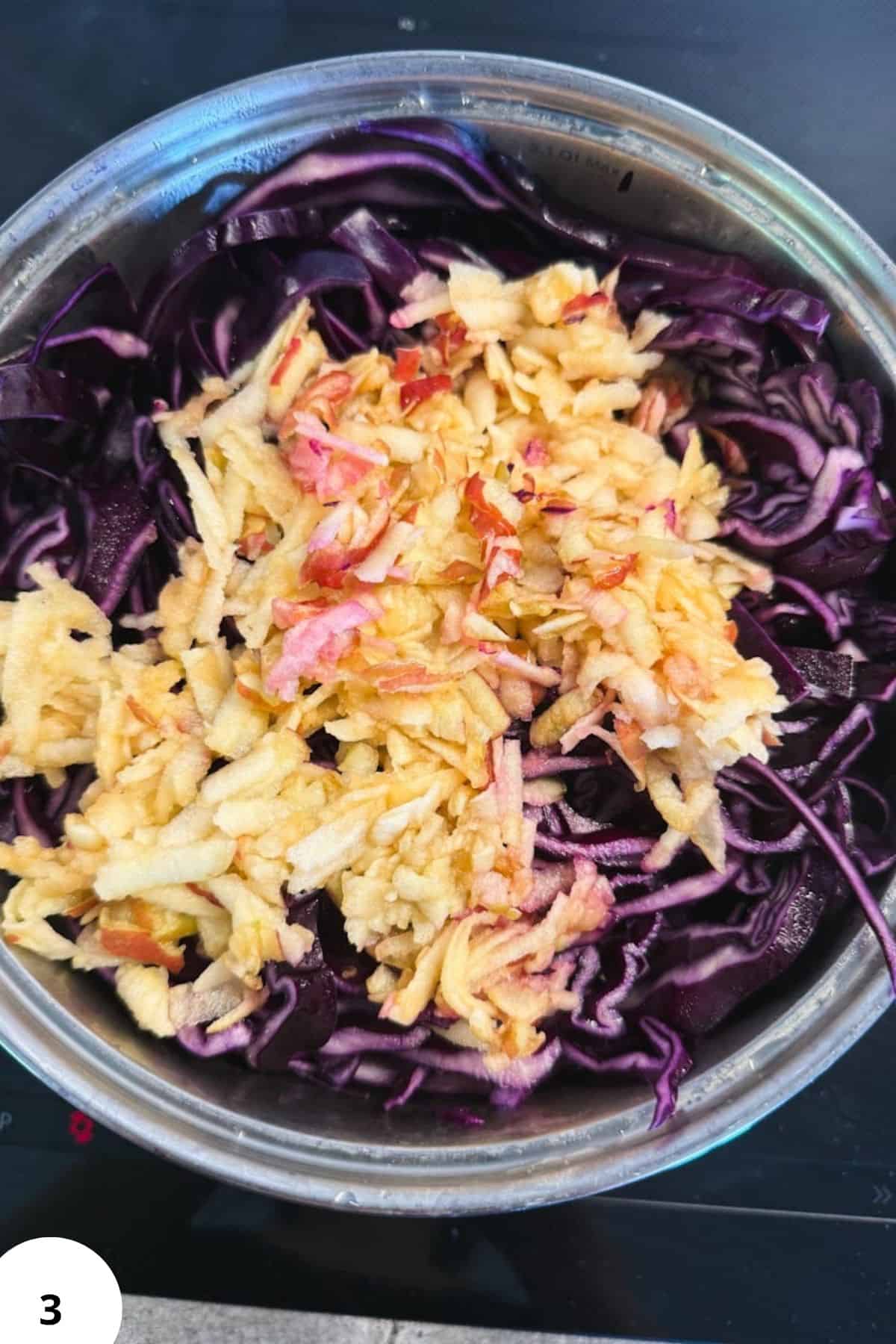 Red cabbage and apple mixture for braising and cooking.