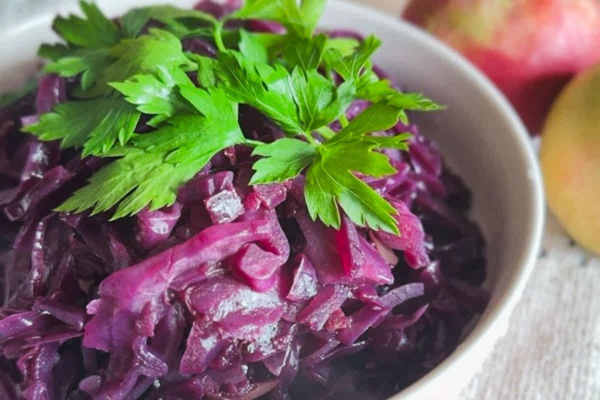 Traditional German Rotkohl with apple, served as a side dish.