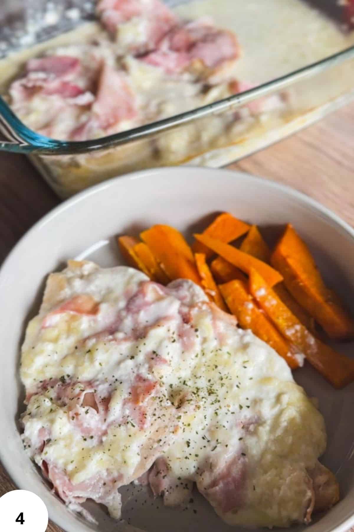 Healthy chicken and sweet potatoes with creamy sauce and herbs.