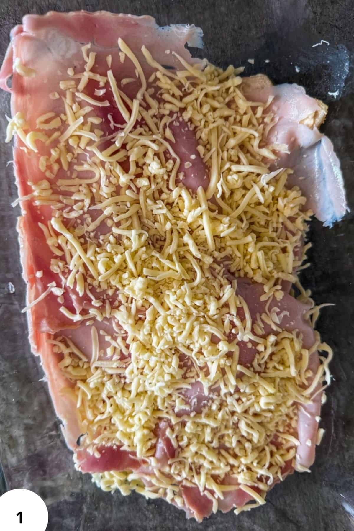 Cheese-topped dough for bread baking.