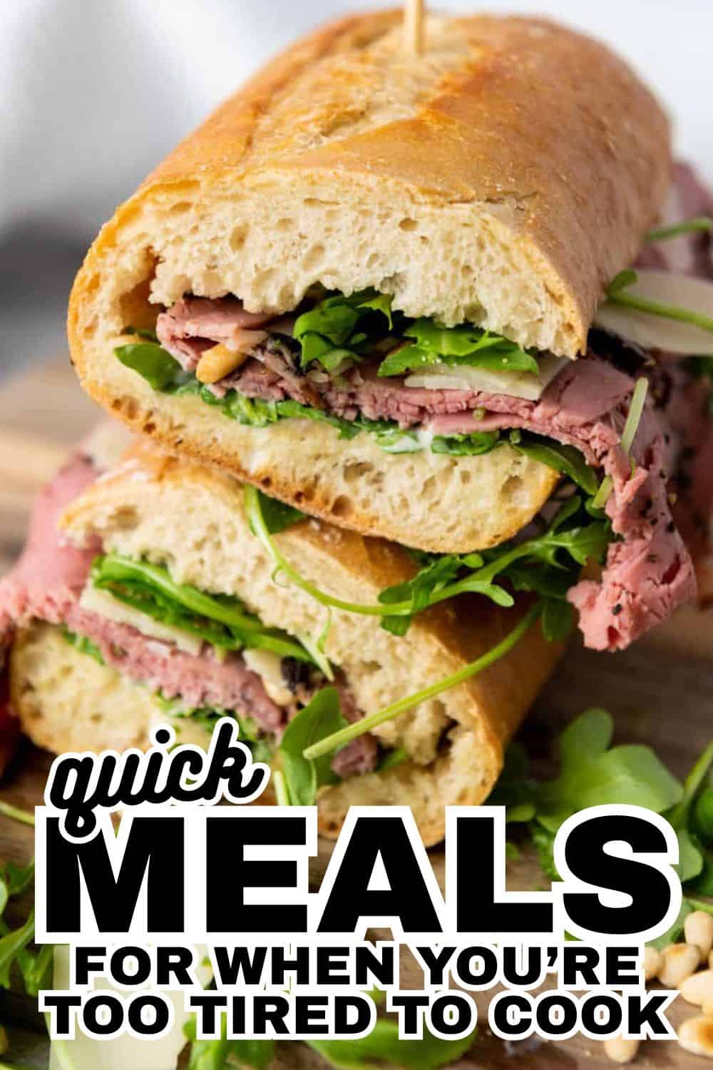 Delicious roast beef sandwich with greens in a crusty baguette.