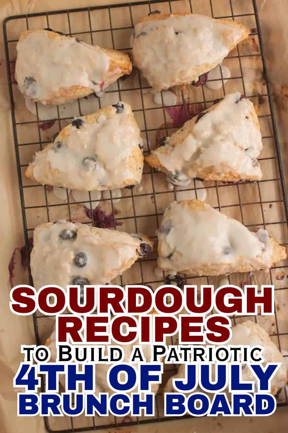 Fresh sourdough pastries with blueberries on a cooling rack.