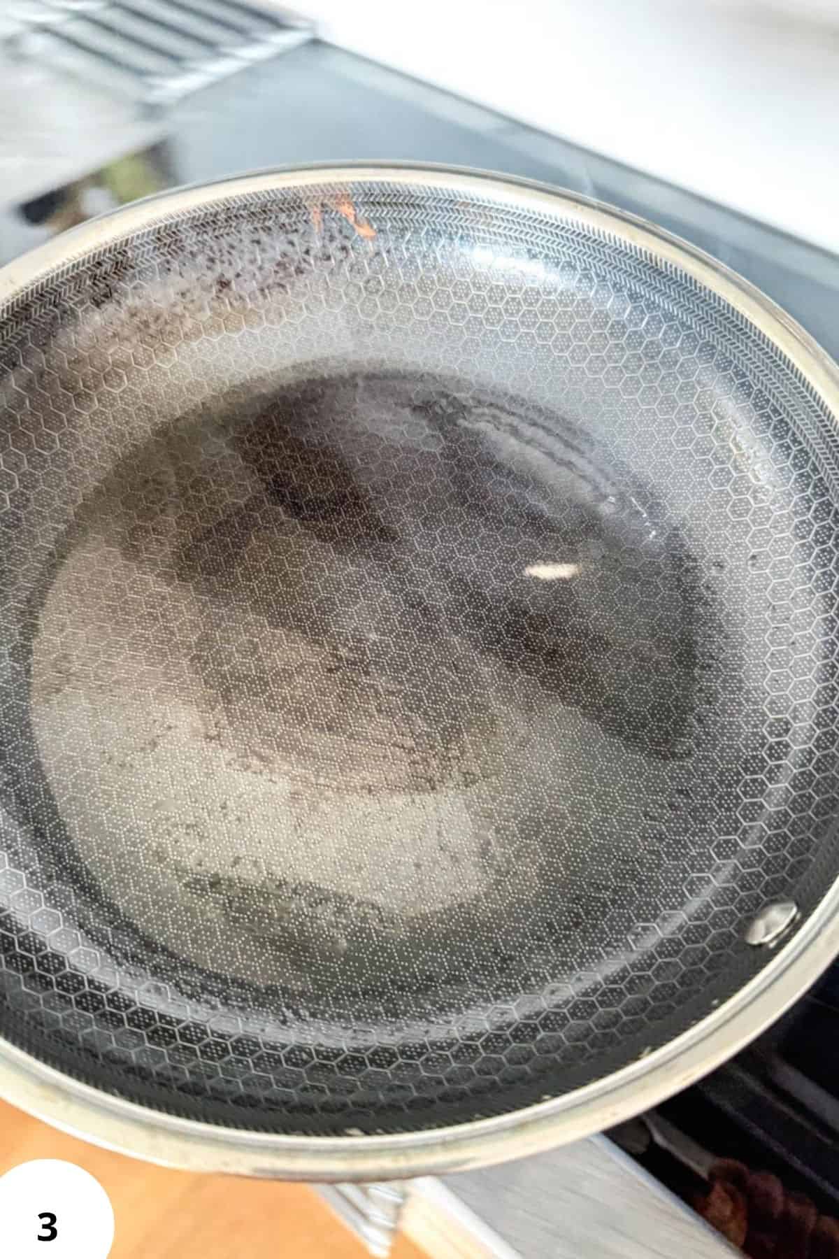 Sourdough Palatschinken batter in a pan, ready for cooking.