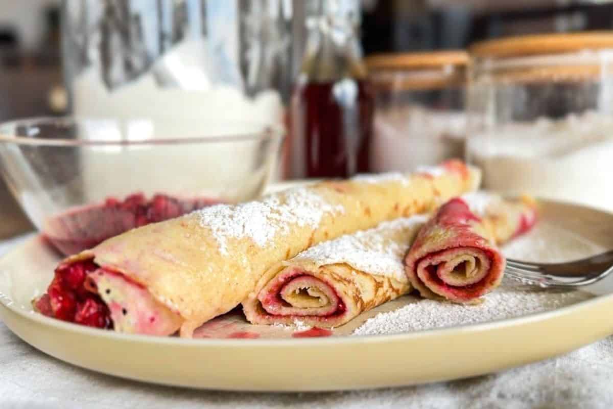 Delicious sourdough crepes with fruit filling, showcasing traditional Central European baking techni.