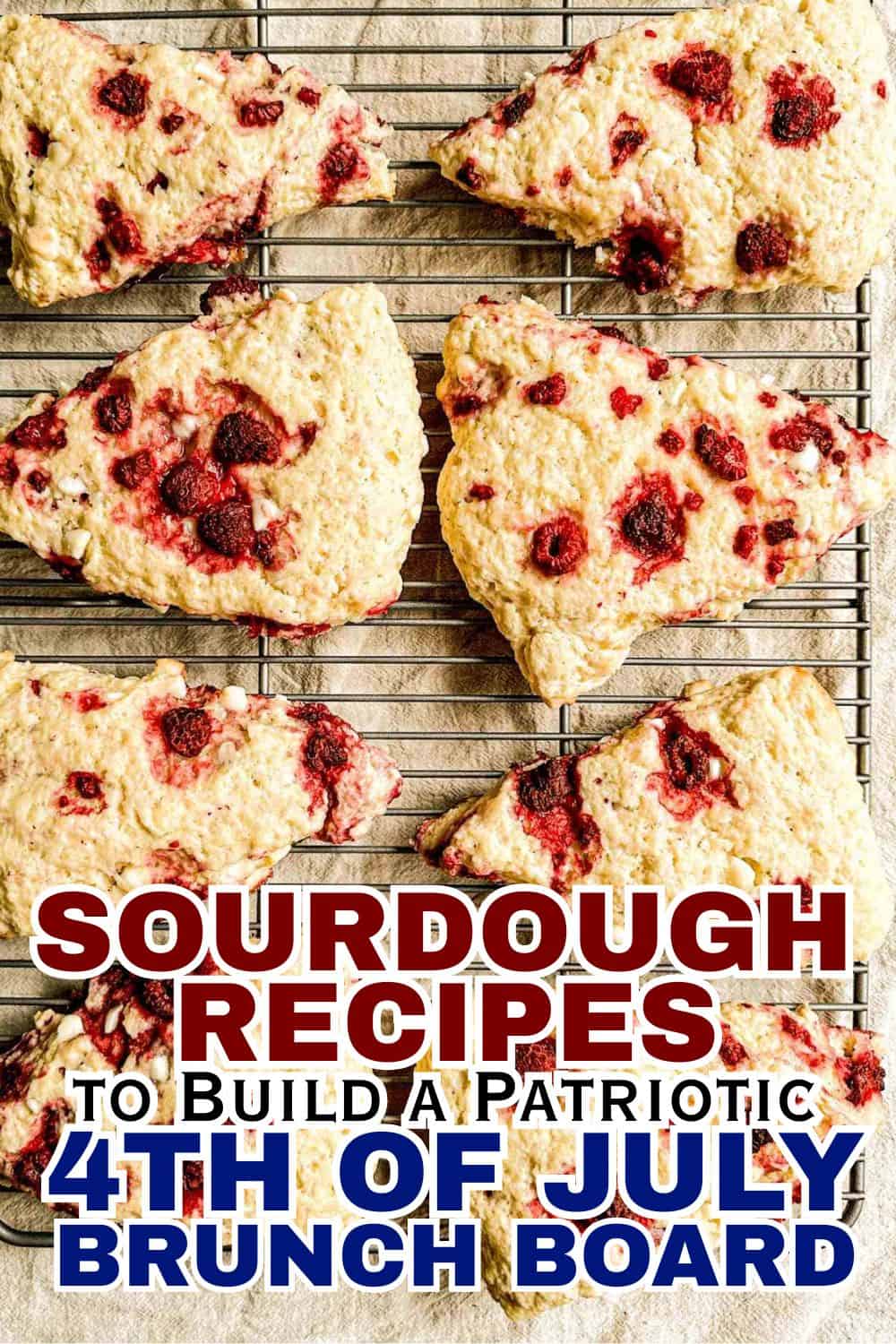 Freshly baked sourdough bread with berries on a cooling rack.