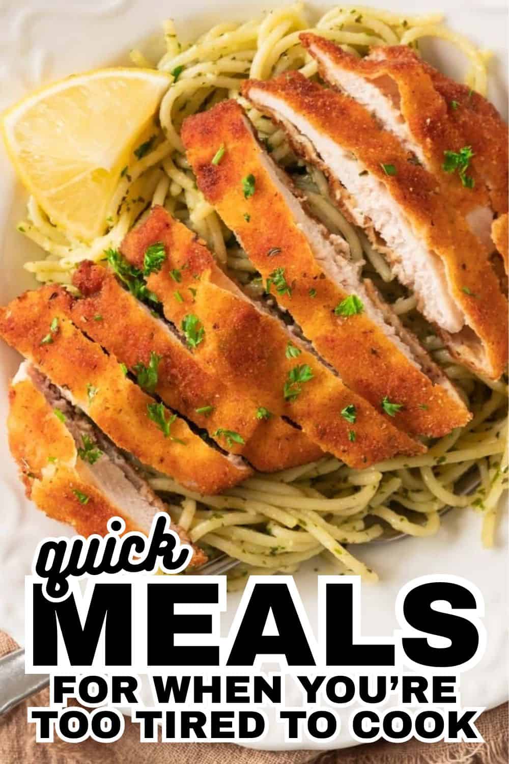 Crispy chicken schnitzel served with lemon and pasta, perfect quick meal for busy days.