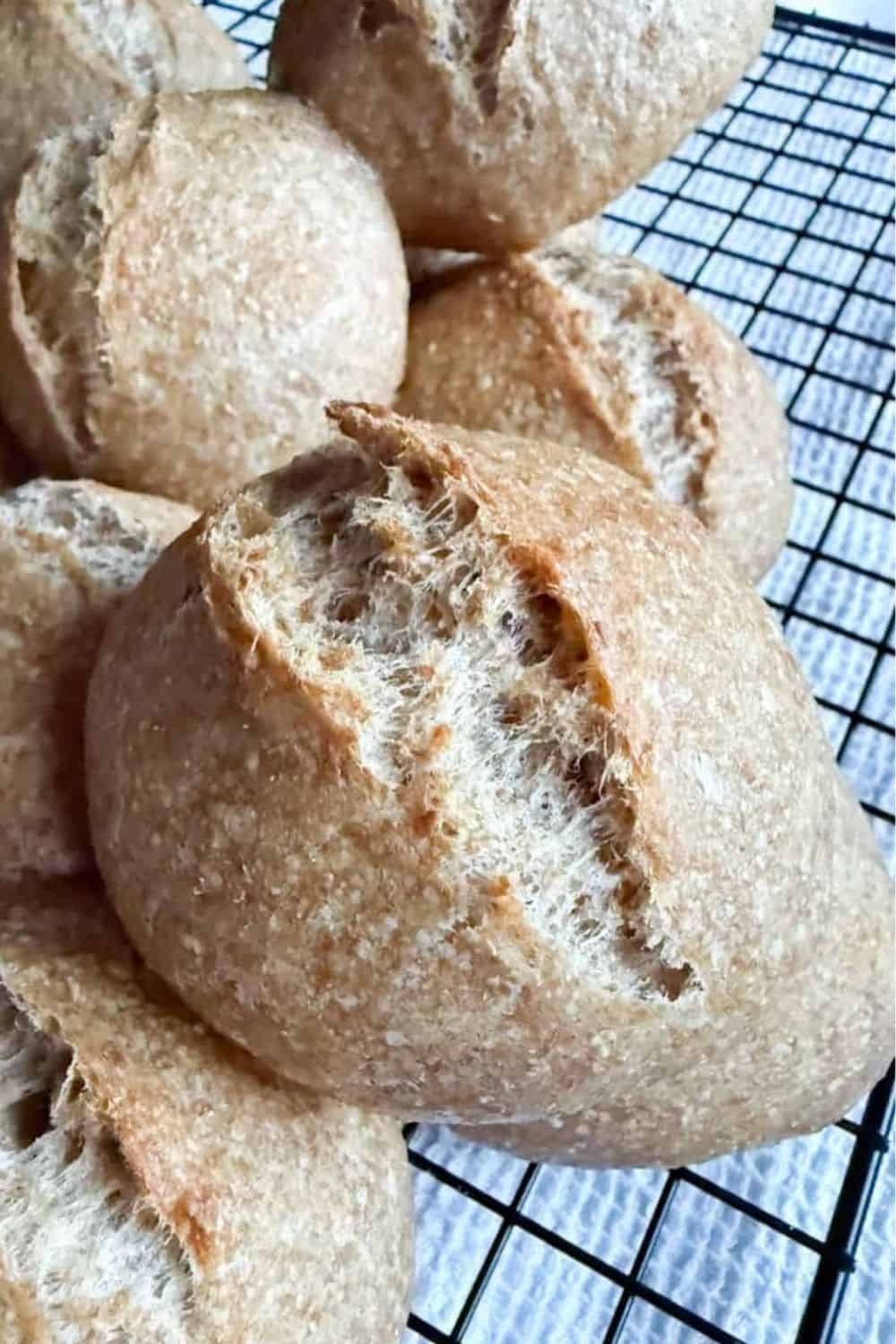 Sourdough bread rolls with a crispy crust and soft interior, perfect for baking enthusiasts.