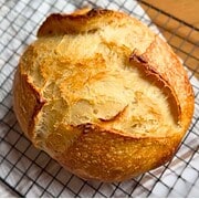 Bread with a golden crust and soft interior, showcasing the art of bread baking and stretch and fold.