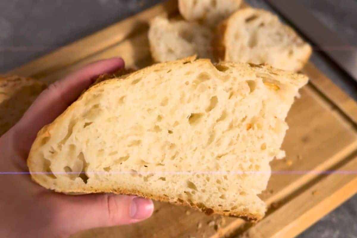 Freshly baked bread with airy crumb and golden crust, perfect for sandwiches or toast.