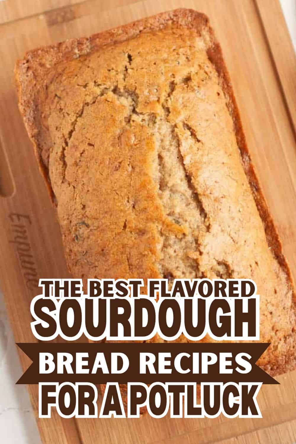 Freshly baked sourdough bread loaf on wooden cutting board.