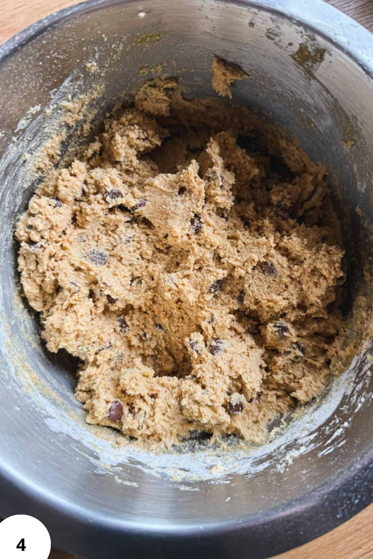 Peanut butter cookie dough made with fresh milled peanuts and chocolate chips, perfect for homemade.