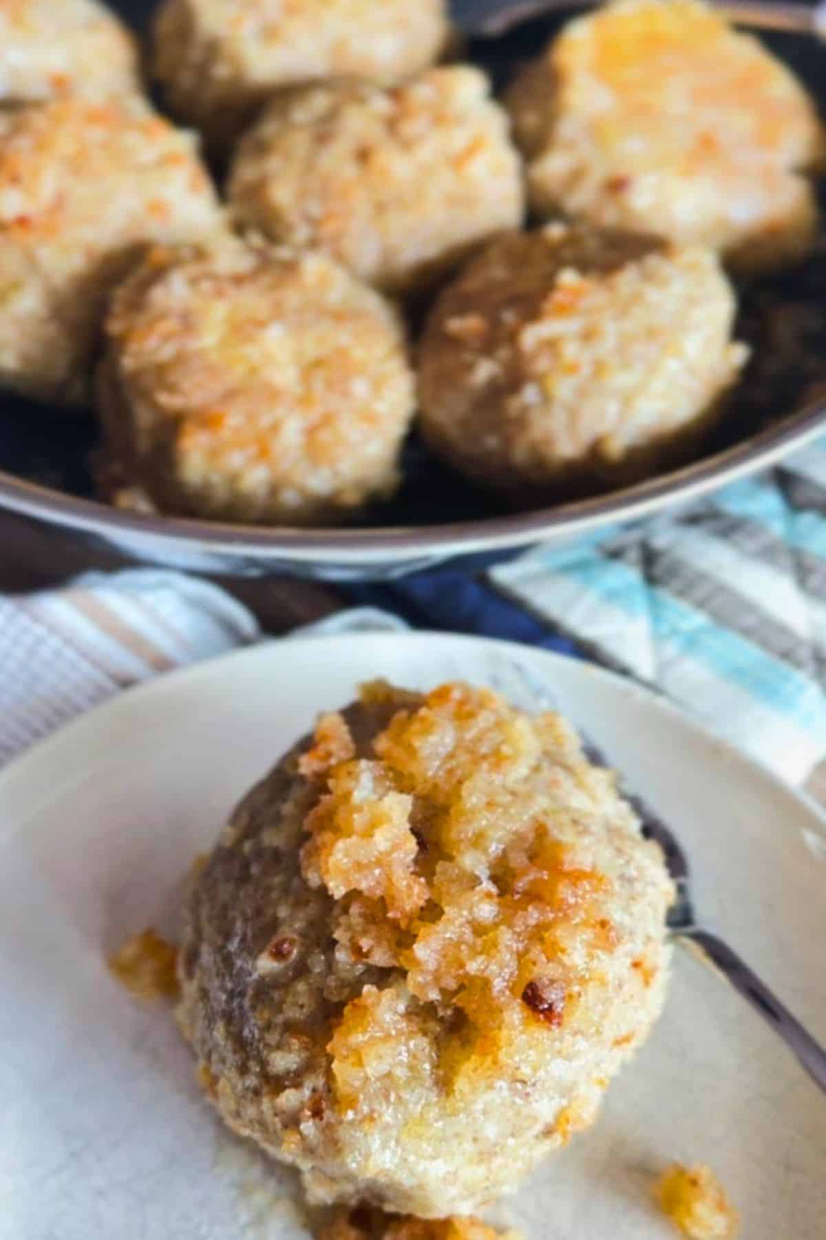 Close-up of freshly made potato plum dumplings with breadcrumb coating.