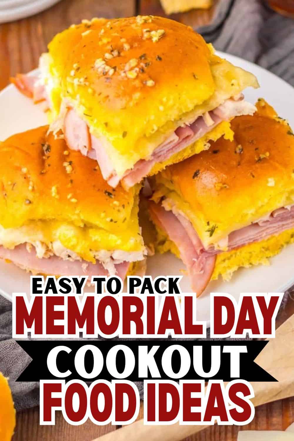Freshly baked dinner rolls filled with ham and cheese, perfect for Memorial Day cookouts.
