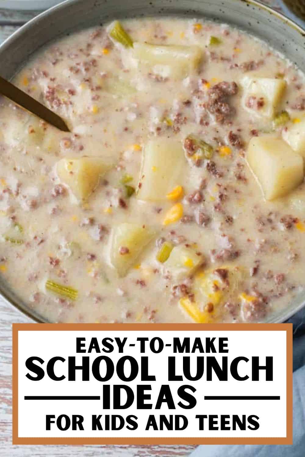 Close-up of creamy potato and corn soup with ground meat and vegetables in a bowl.