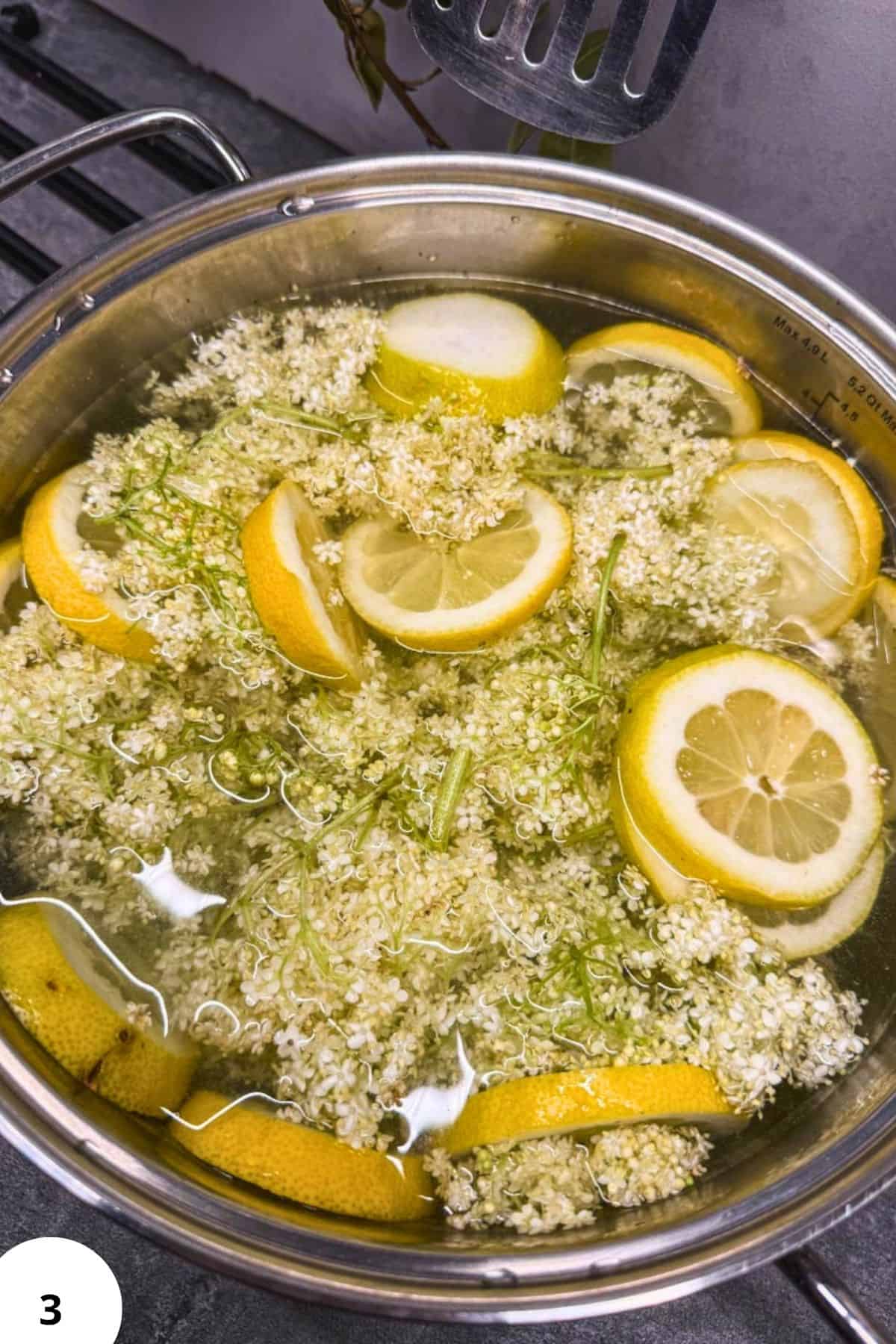 Lemon and elderflower infusion in a glass bowl for bread fermentation process.