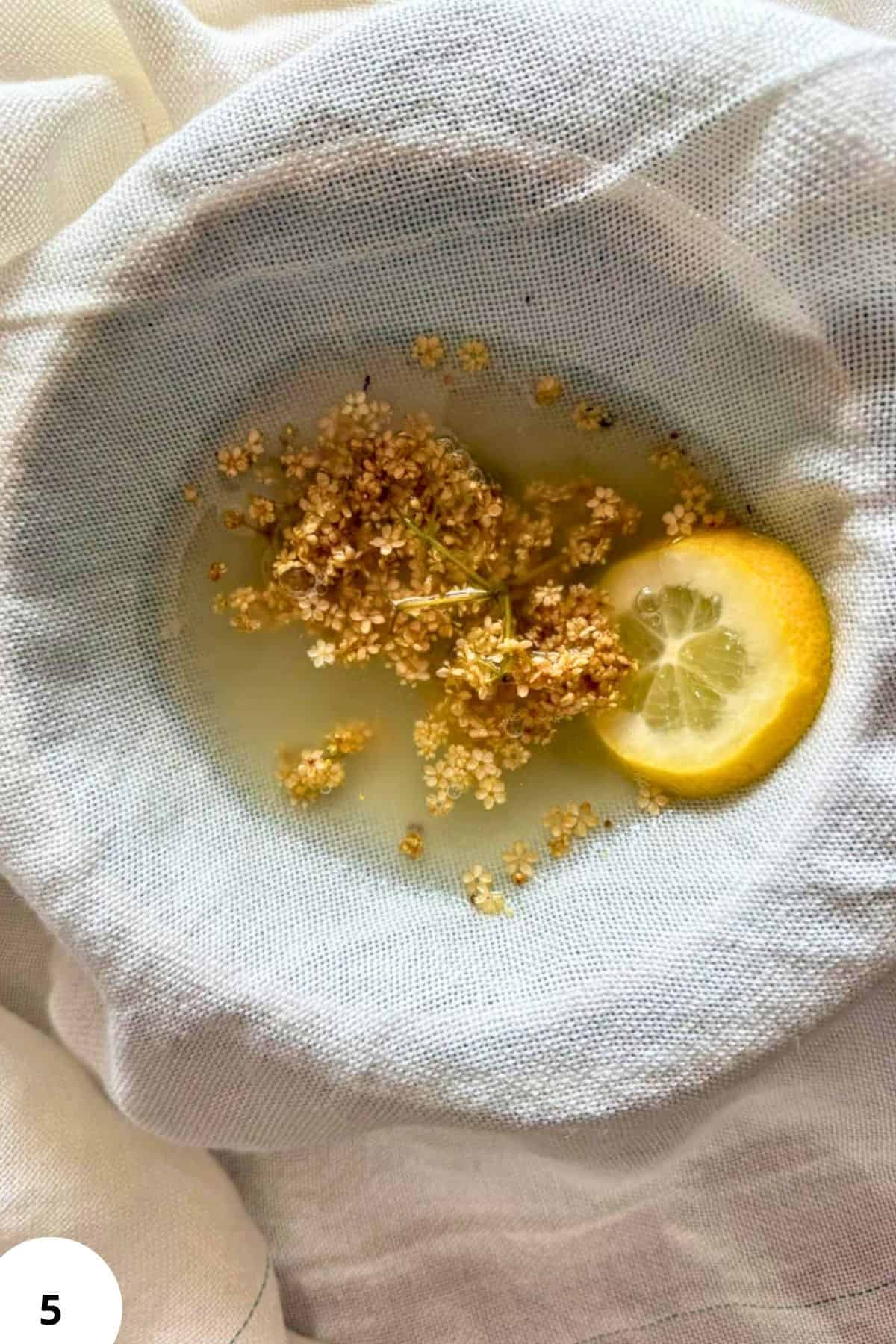 Lemon and elderflower infusion in a cloth bag for baking or tea preparation.