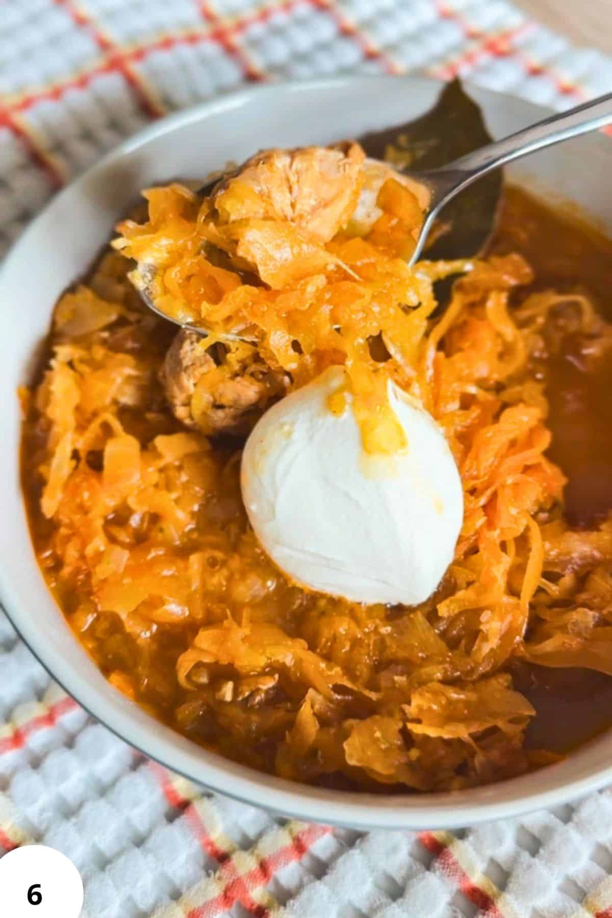 Hearty pork and sauerkraut goulash served with a dollop of sour cream. Perfect comfort food for cold.