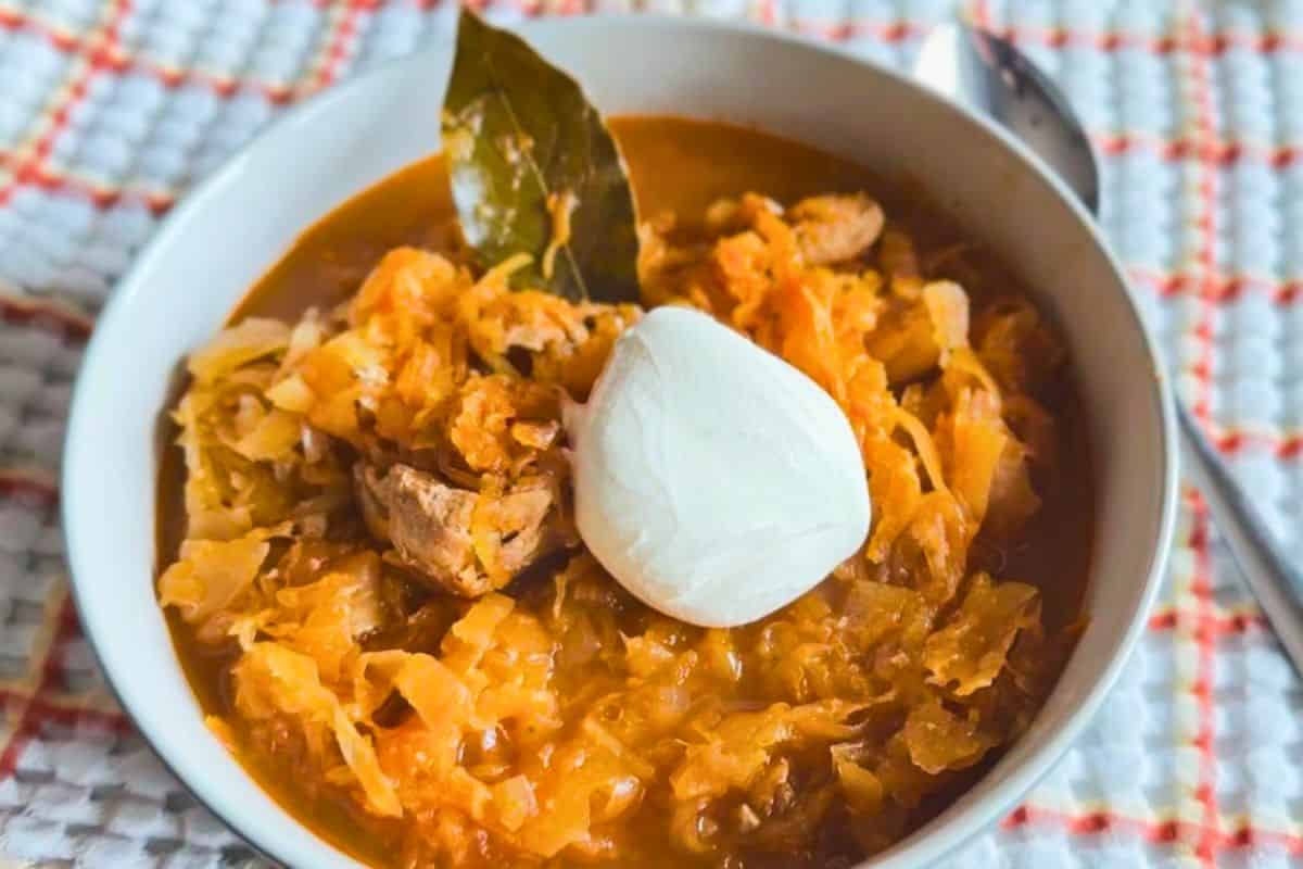 Traditional Pork and Sauerkraut Goulash served with a dollop of sour cream.