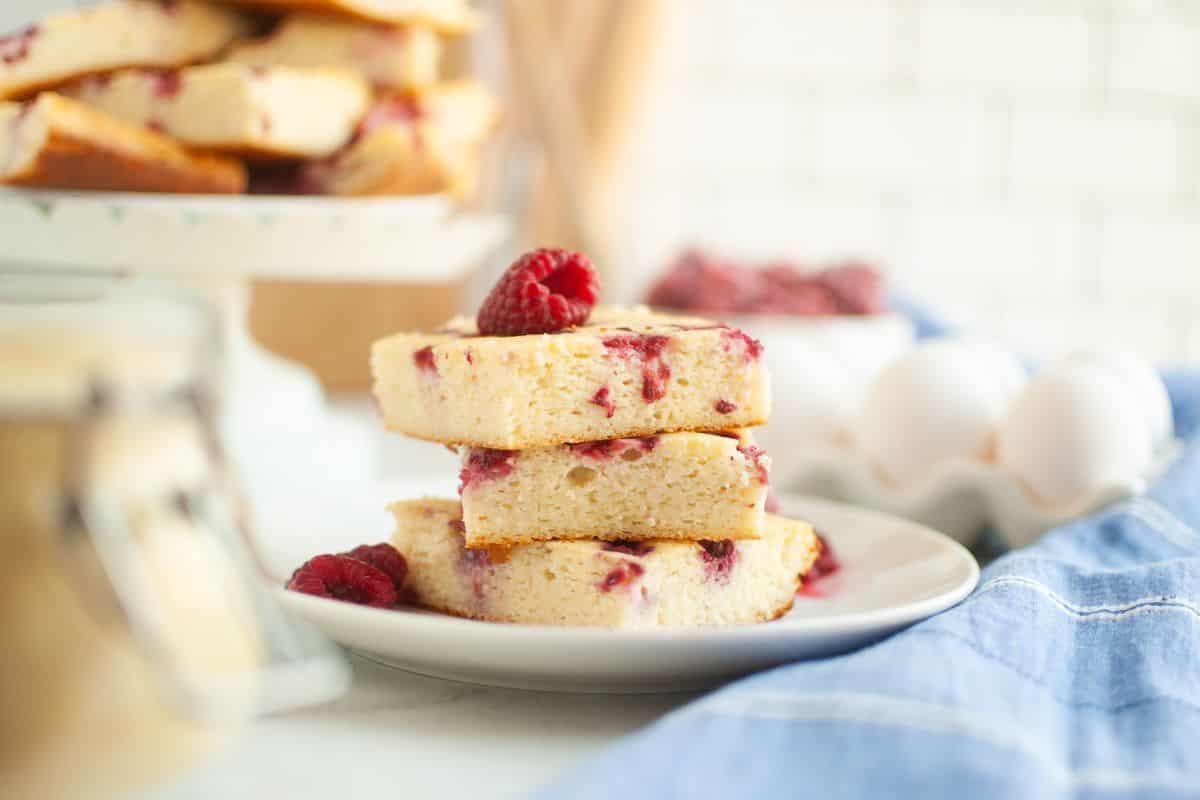 Raspberry cake slices on a white plate, perfect for baking and bread making, showcasing the art of s.