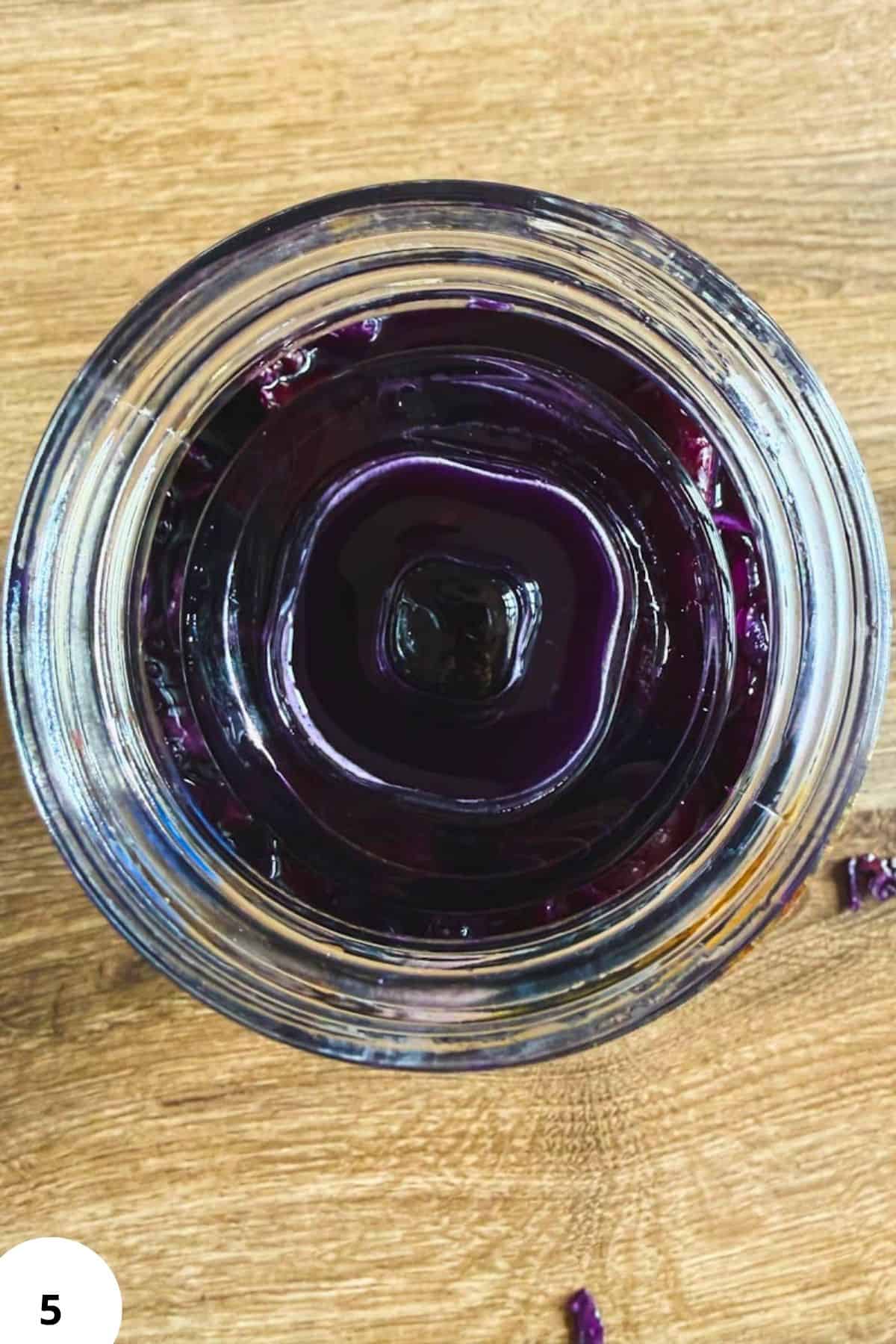 Sourdough starter in a glass jar, showing active fermentation for bread baking.