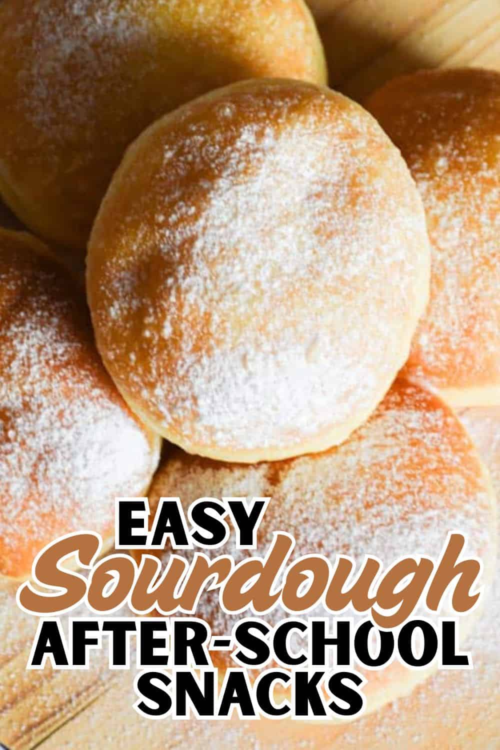 Freshly baked bread dough balls dusted with flour, perfect for sourdough baking.