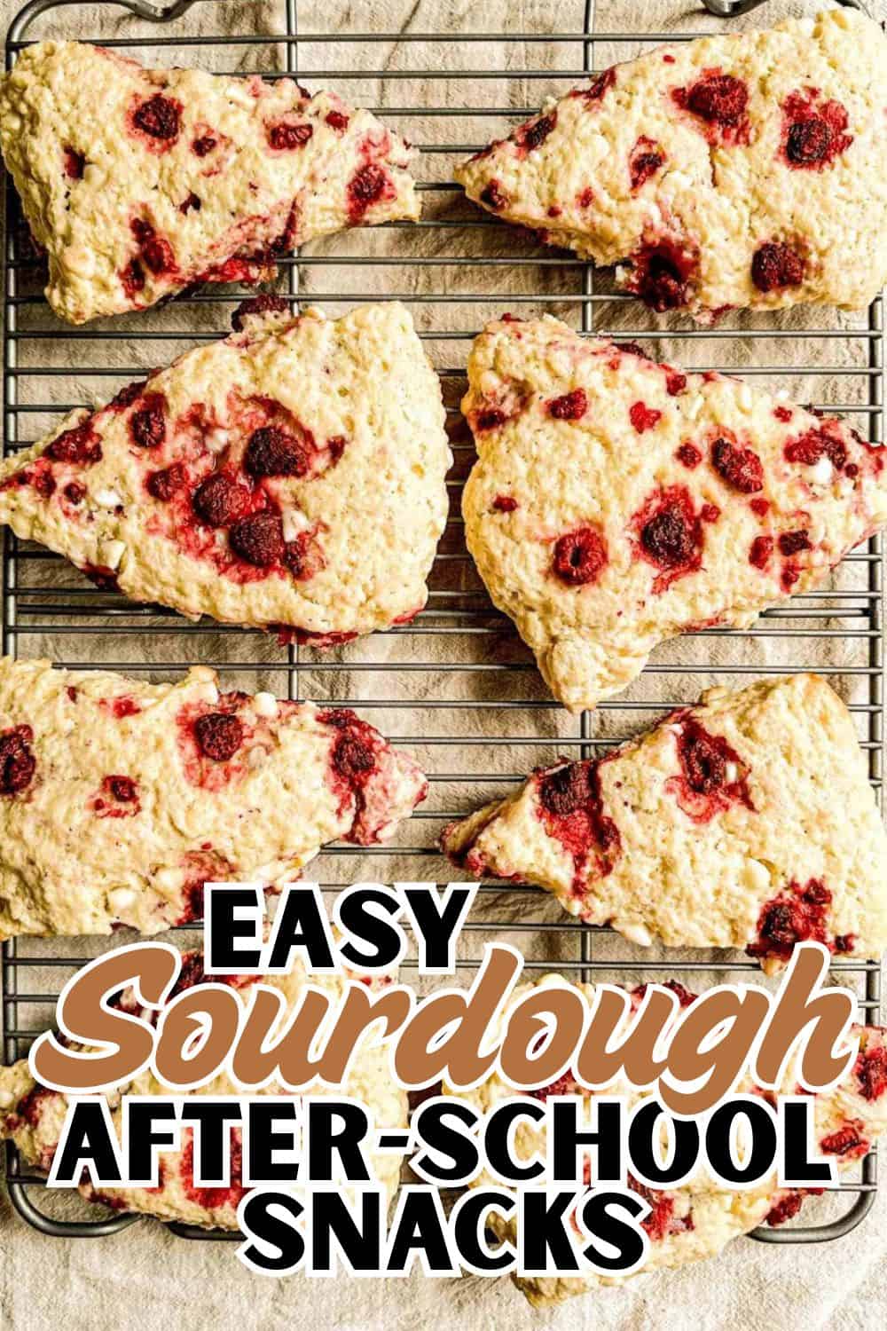 Fresh sourdough bread slices with berries cooling on a wire rack.
